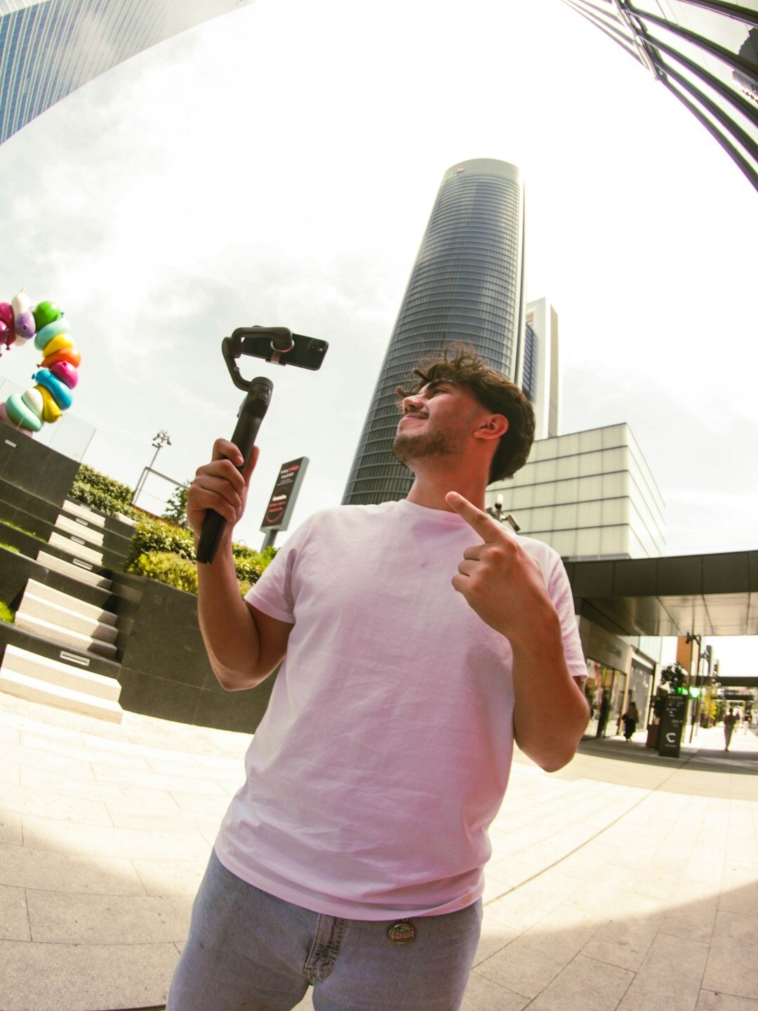 Male reporter holding a microphone outdoors