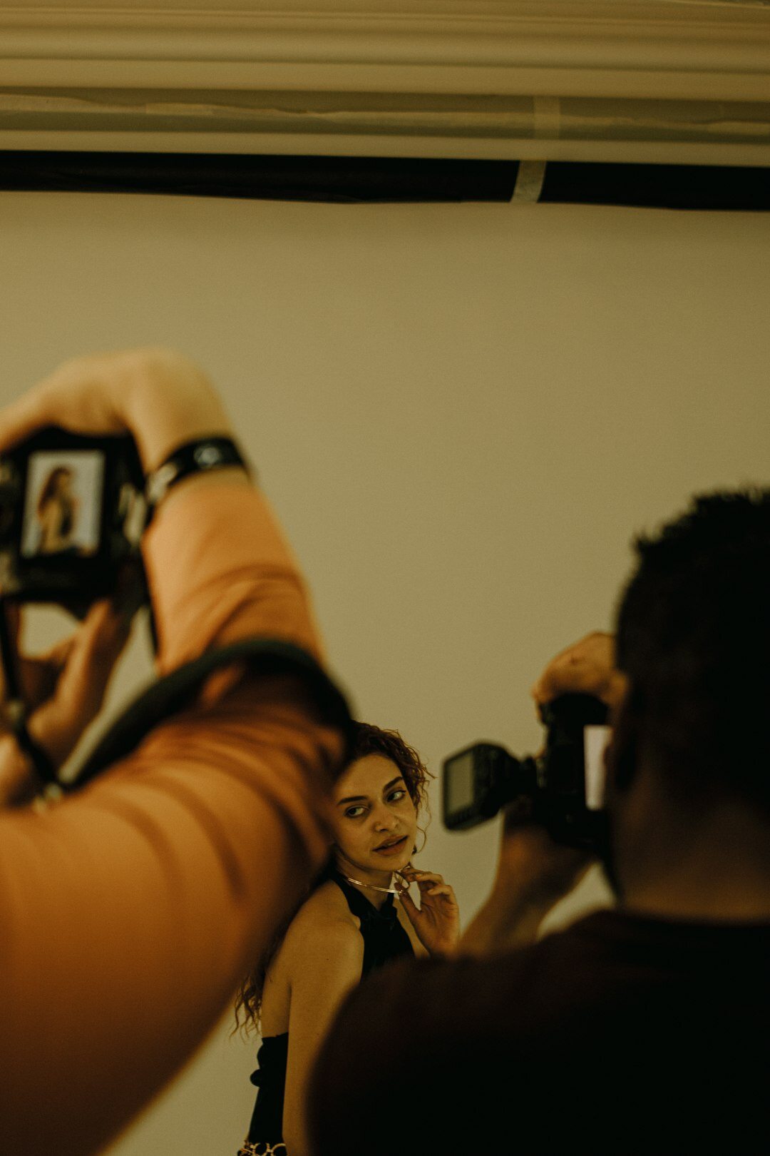 Trainees practicing camera framing during a workshop