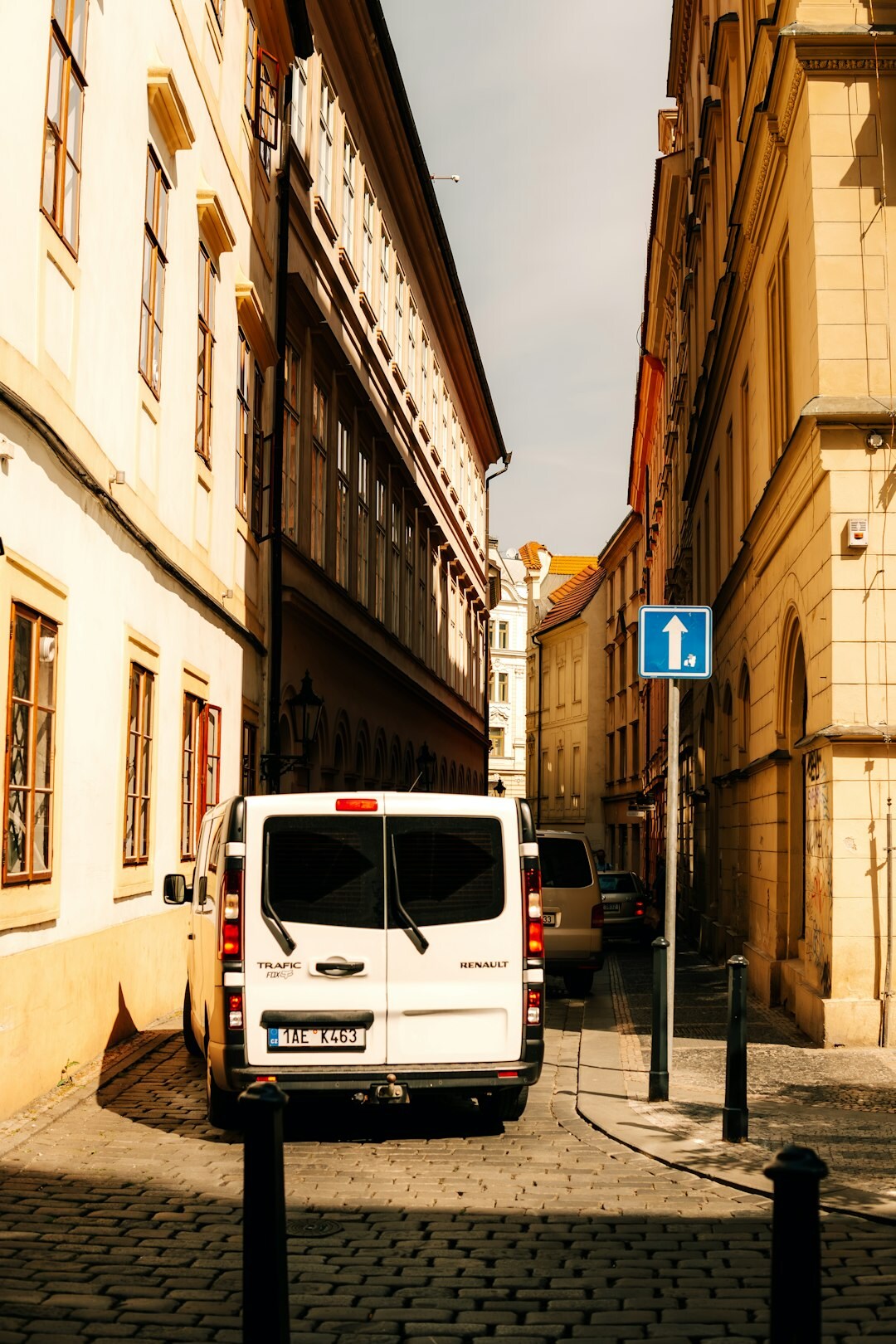 Satellite broadcast van with cables and antenna on a city street